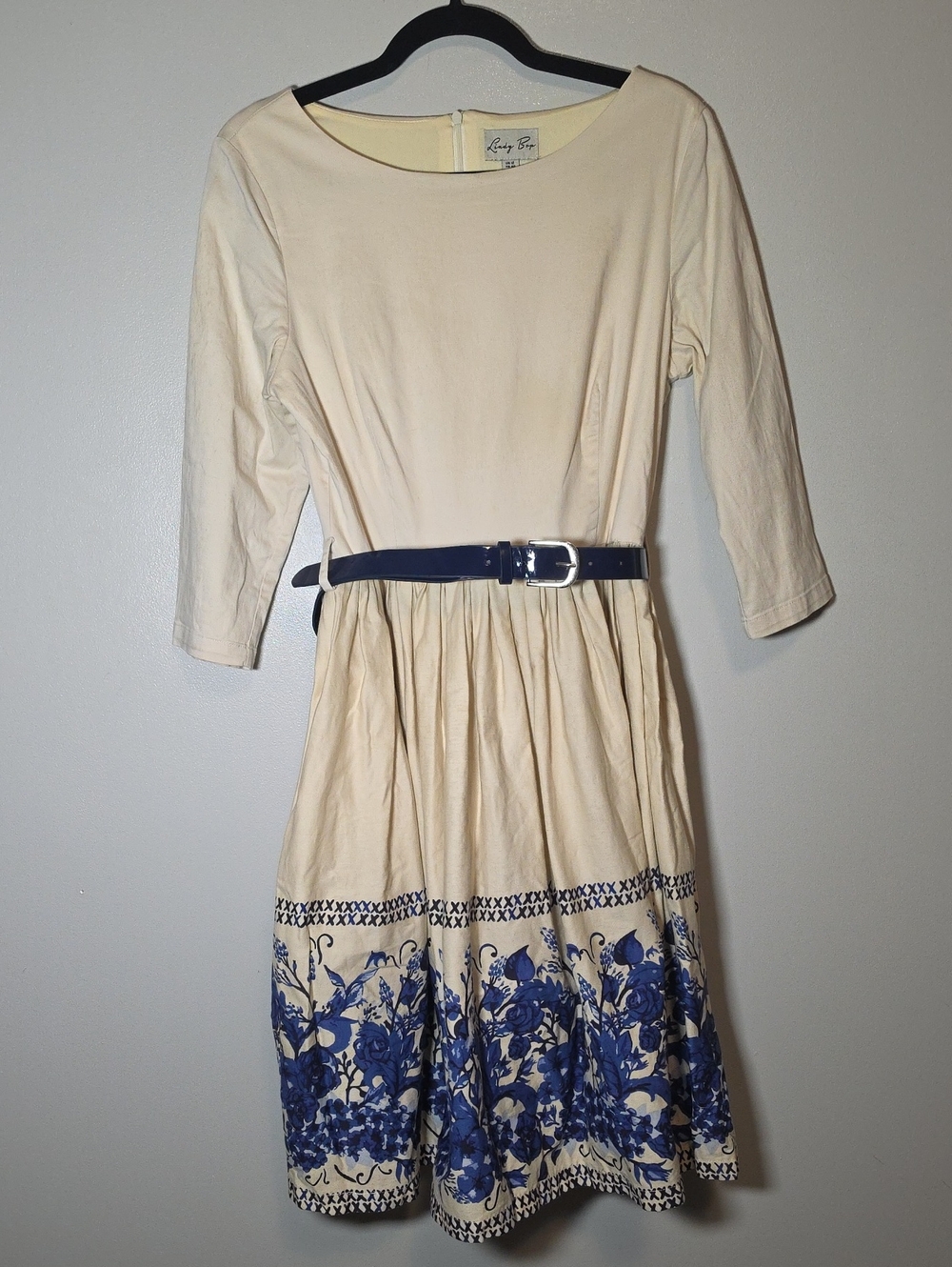 Lindy Bop Cream Dress with Navy Floral Border and Patent Belt